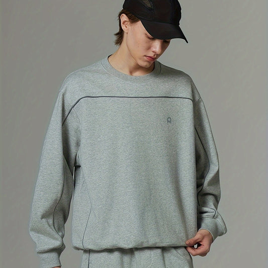 Sudadera gris holgada con cuello redondo y manga larga