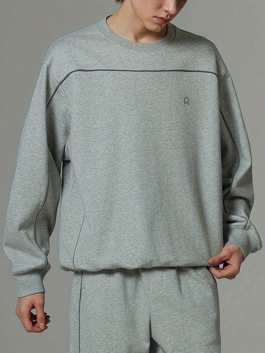 Sudadera gris holgada con cuello redondo y manga larga