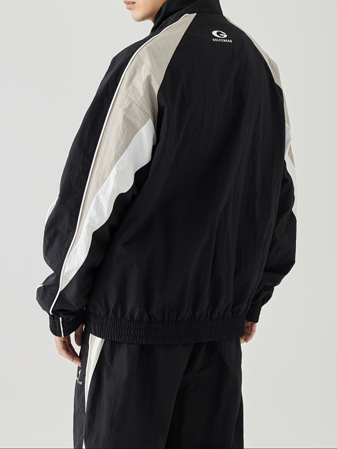Chaqueta casual con mangas raglán rayadas en el lado con cuello alto, para primavera y otoño